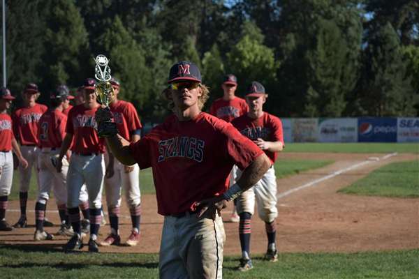 Medford Mustangs 2020 player holds trophy