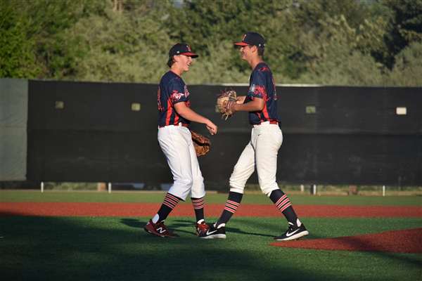 Medford Mustangs 2021 teammates fist bump