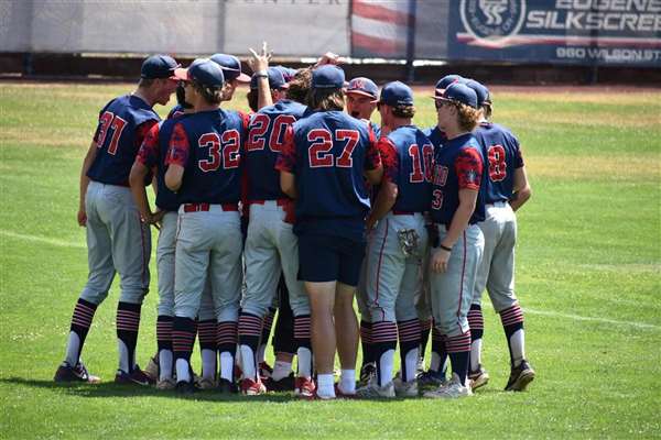 Medford Mustangs 2024 team huddle on field