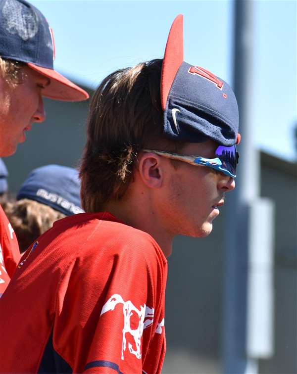 Medford Mustangs 2025 player rally cap dugout